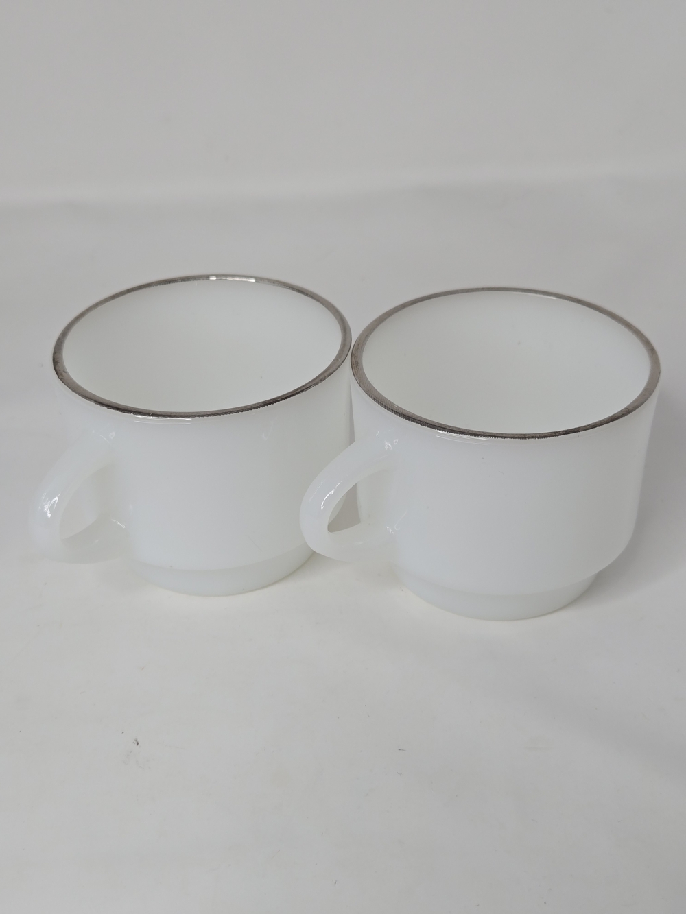 Set of 2 Vintage Anchor Hocking Fire King Coffee cups white w/ silver trim